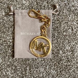 Michael Kors purse charm.